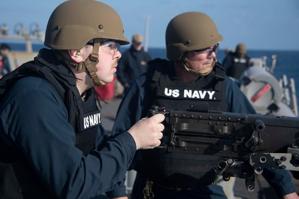 Sailor fires .50-caliber machine gun during a live-fire event aboard USS Gonzalez.