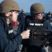 Sailor fires .50-caliber machine gun during a live-fire event aboard USS Gonzalez.