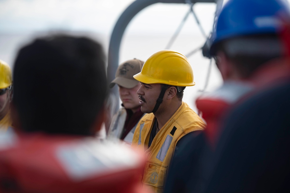 Sailor gives safety brief before a replenishment-at-sea.