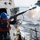 Sailor fires shot line during a replenishment-at-sea. Sailor fires shot line during a replenishment-at-sea.
