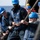 Sailors heave line during a replenishment-at-sea. Sailors heave line during a replenishment-at-sea.