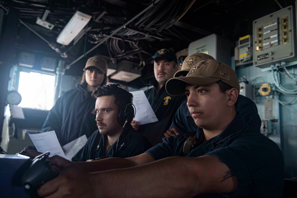 Sailor operates weapon system during a live-fire event.