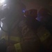 Sailors fight simulated fire.