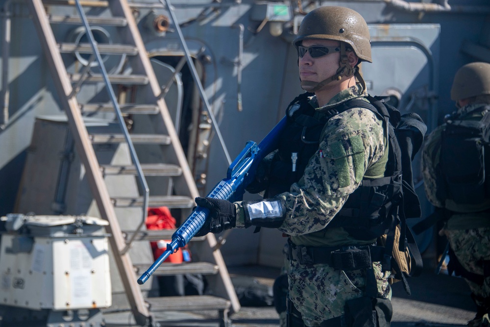 Sailor holds perimeter during a VBSS training evolution.