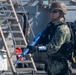 Sailor holds perimeter during a VBSS training evolution.