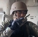 Sailor communicates using a hand-held radio during a VBSS drill.