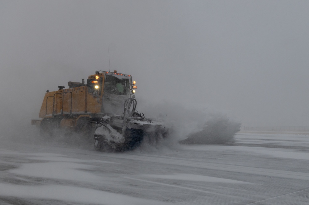 22nd Civil Engineering Squadron clears snow from the flight line