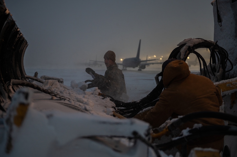 22nd Civil Engineering Squadron clears snow from the flight line