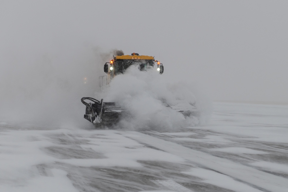 22nd Civil Engineering Squadron clears snow from the flight line