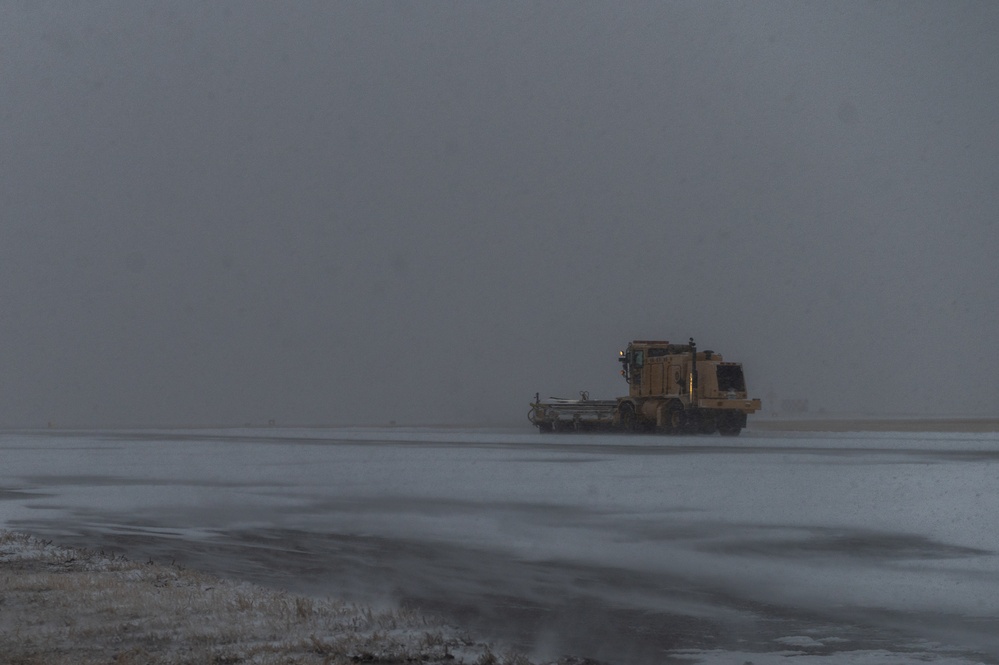 22nd Civil Engineering Squadron clears snow from the flight line