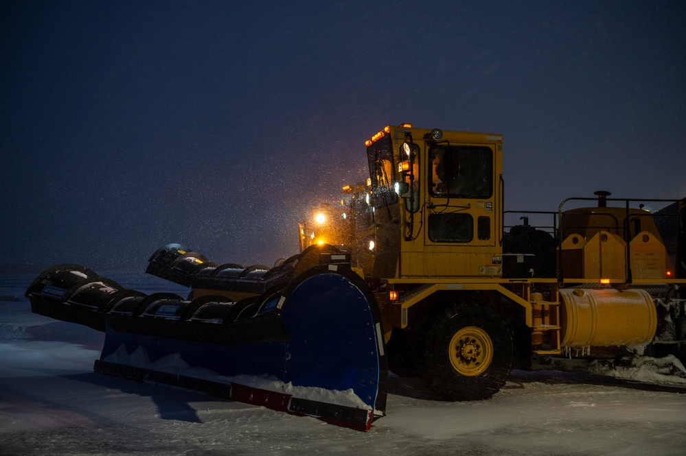 22nd Civil Engineering Squadron clears snow from the flight line