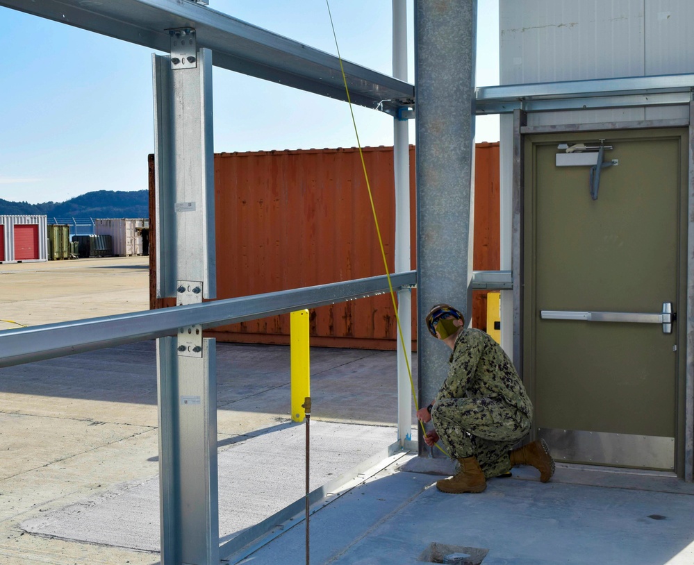 NMCB THREE Detail Sasebo Seabee measurespre constructed building for NBU 7