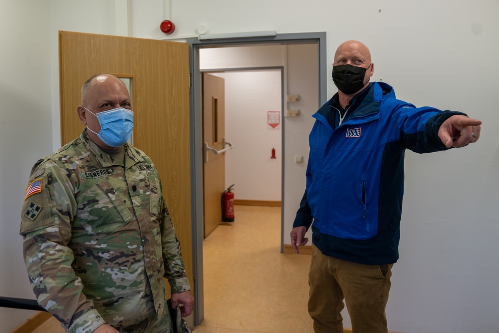 Lt. Col. Miguel Cisneros tours building with USO leadershipe