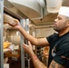 Abraham Lincoln Sailors prepare food