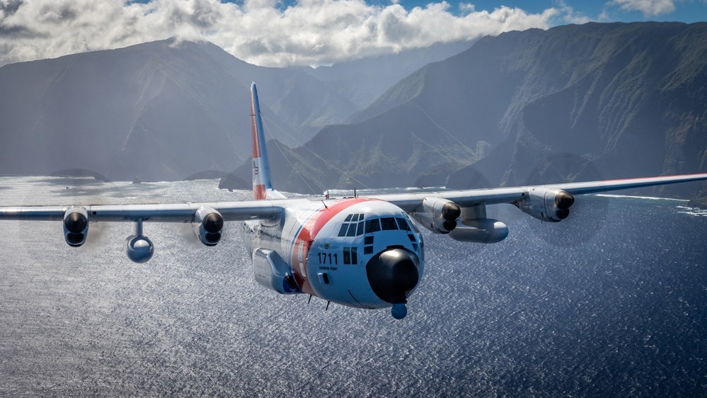 Coast Guard Air Station Barbers Point HC-130 flys over Hawaiian Islands