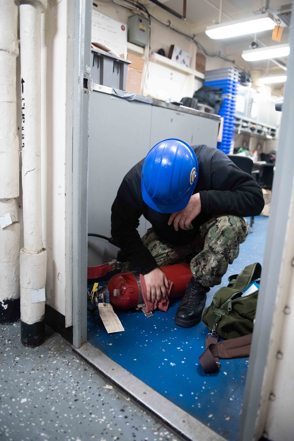 Sailor performs maintenance