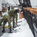 USS Constitution Sailors shovel snow