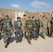 Coalition members inspect ammunition warehouses with Peshmerga leaders