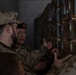 Coalition members inspect ammunition warehouses with Peshmerga leaders