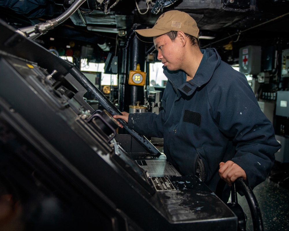 Professional Apprenticeship Career Tract (PACT) Seaman Dinh Do, from Orlando, Fla., mans the lee helm