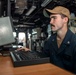 Boatswain’s Mate 2nd Class Justin Bauer, from Fredrick, Colo., searches for surface contacts