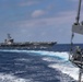 Abraham Lincoln conducts a replenishment-at-sea with Mobile Bay