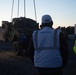 Soldiers and civilians assigned to 624th Movement Control Team download equipment at Grafenwoehr Training Area