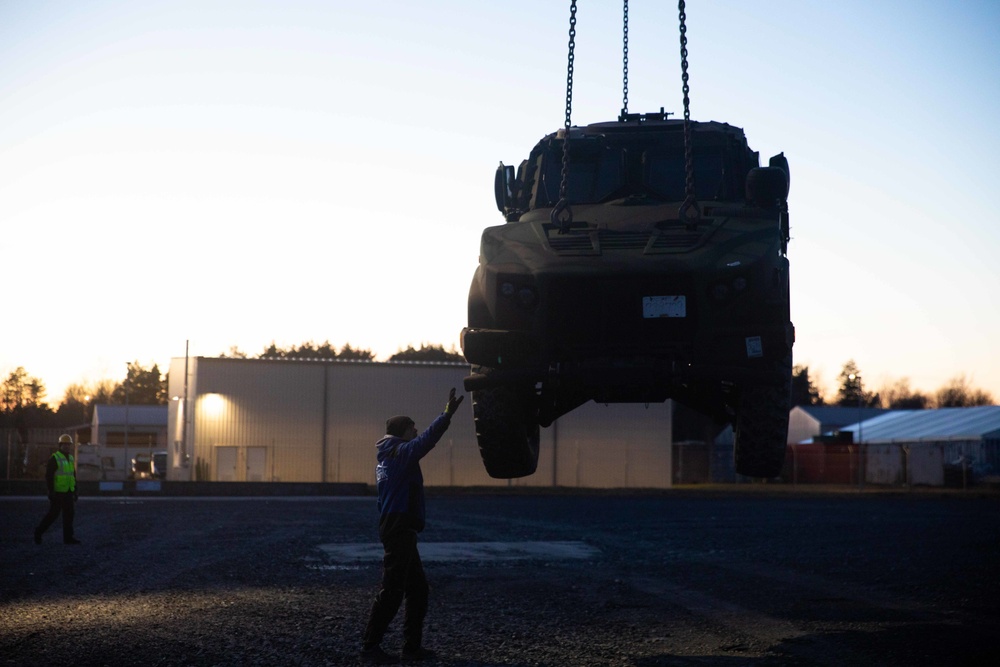 Soldiers assigned to 624th Movement Control Team monitor the download of equipment at Grafenwoehr Training Area