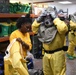Sailors suit up in full personal protective equipment