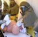 Sailors dry off simulated contaminated patient