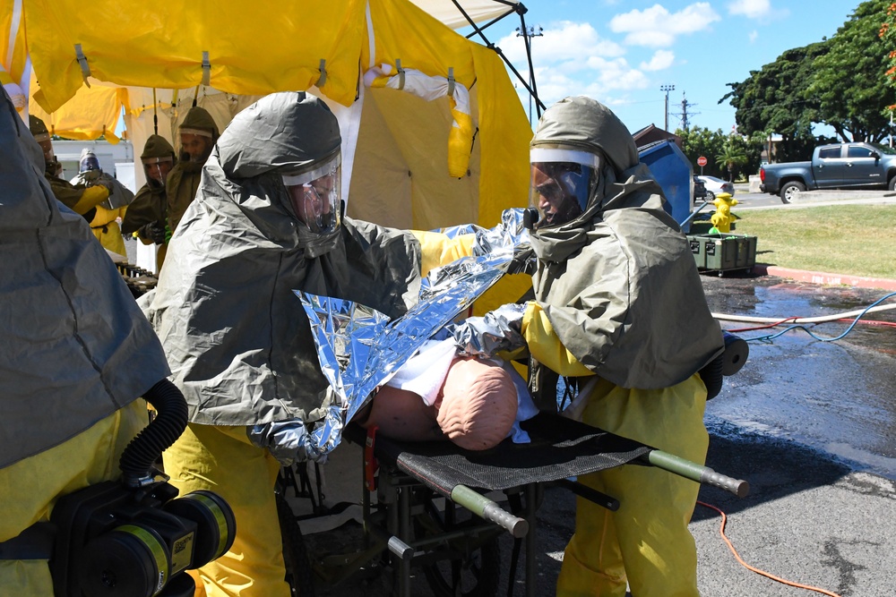 Sailors cover simulated de-contaminated patient