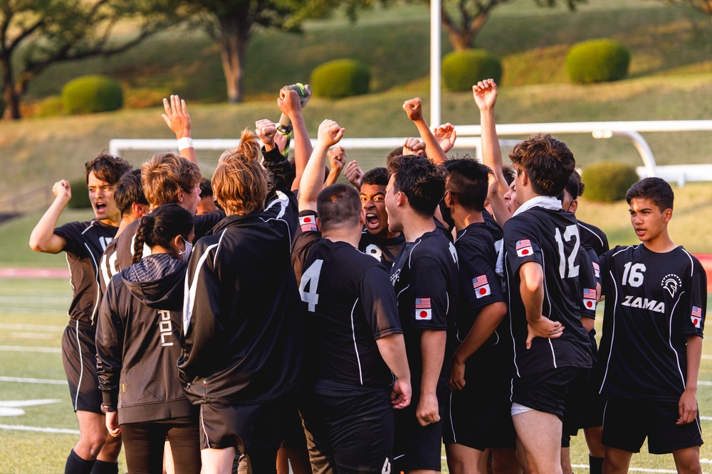 Zama High school Soccer team members and their coach were gaining motivation to win the game at the pitch on Apr 27, 2021.