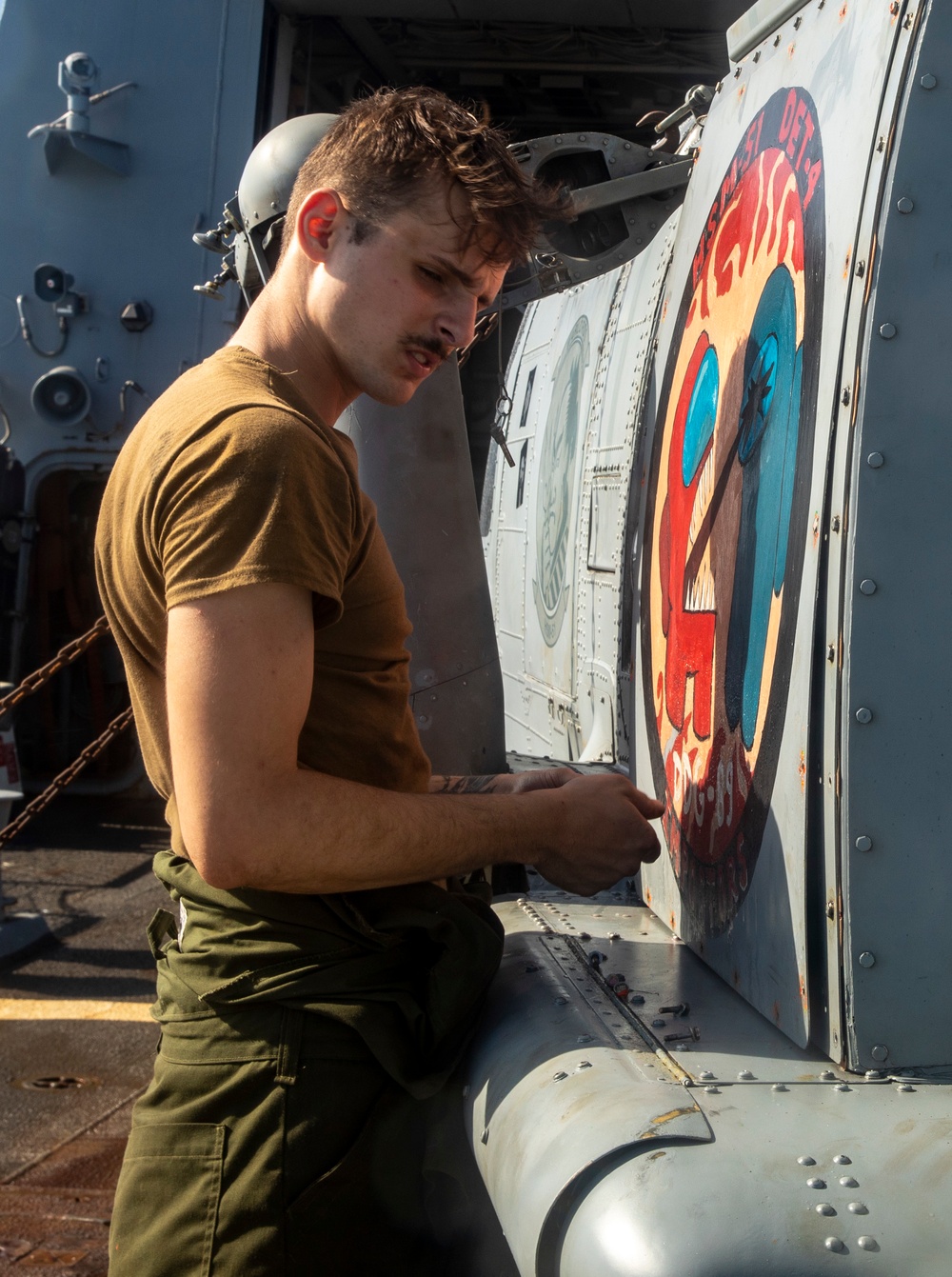 Sailors Aboard USS Ralph Johnson (DDG 114) Conduct a Helicopter Wash Down