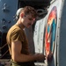 Sailors Aboard USS Ralph Johnson (DDG 114) Conduct a Helicopter Wash Down