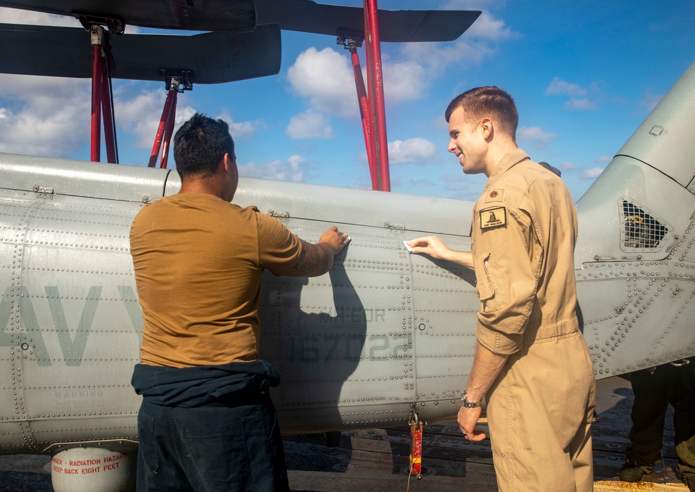 Sailors Aboard USS Ralph Johnson (DDG 114) Conduct a Helicopter Wash Down