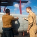 Sailors Aboard USS Ralph Johnson (DDG 114) Conduct a Helicopter Wash Down