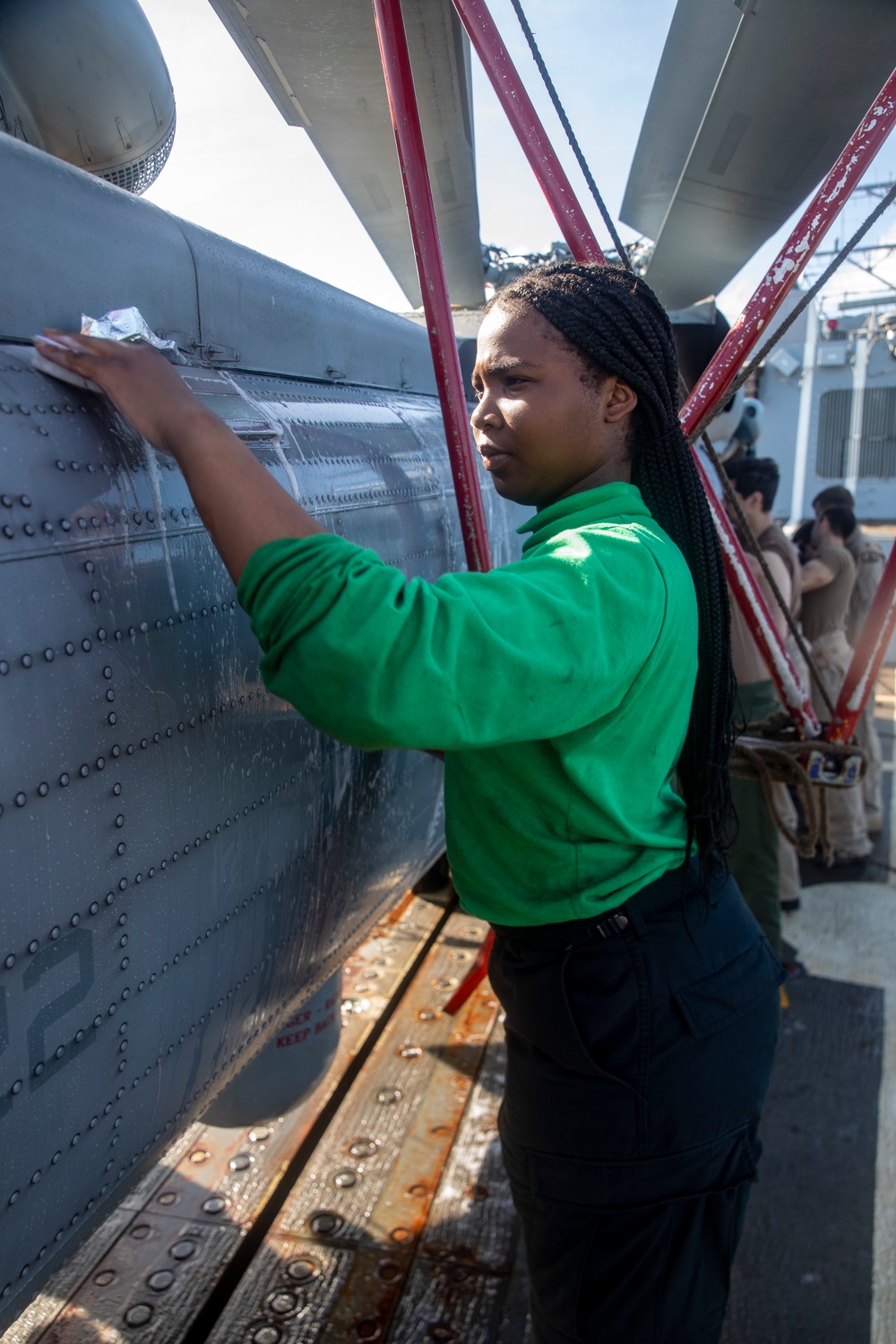 Sailors Aboard USS Ralph Johnson (DDG 114) Conduct a Helicopter Wash Down