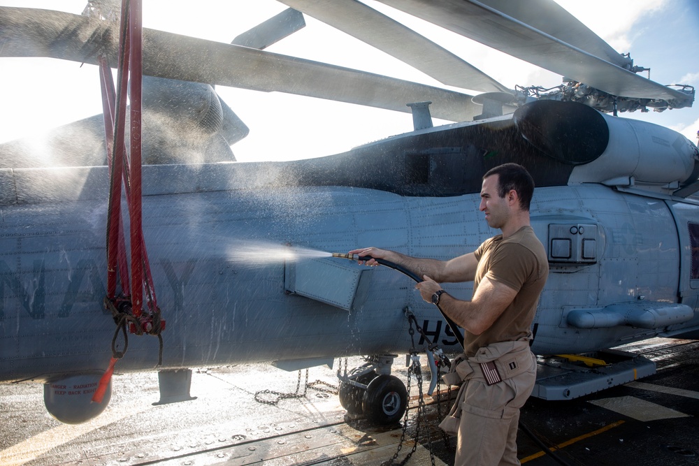 Sailors Aboard USS Ralph Johnson (DDG 114) Conduct a Helicopter Wash Down