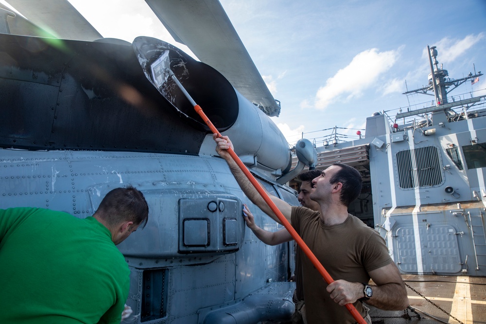 Sailors Aboard USS Ralph Johnson (DDG 114) Conduct a Helicopter Wash Down