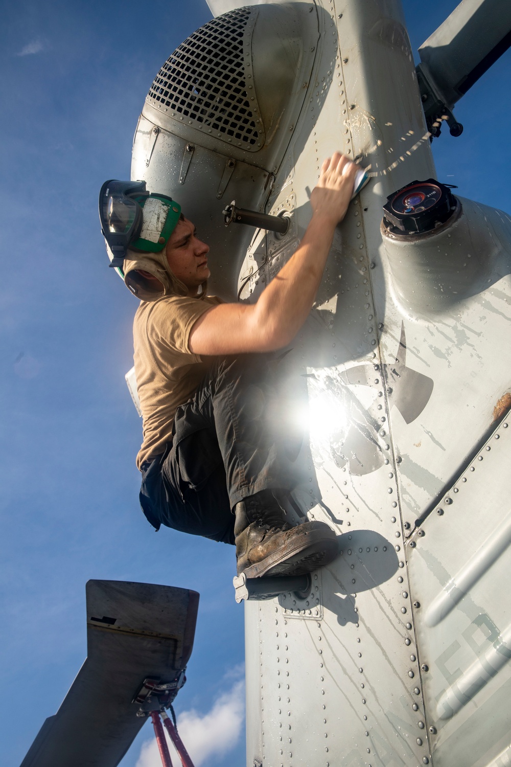 Sailors Aboard USS Ralph Johnson (DDG 114) Conduct a Helicopter Wash Down