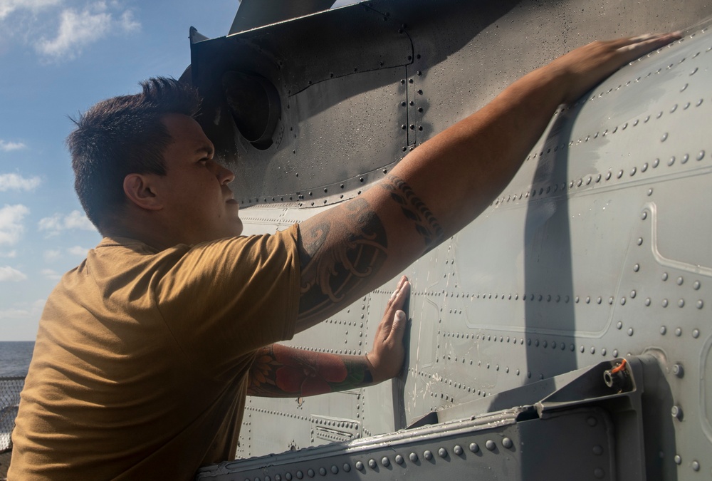 Sailors Aboard USS Ralph Johnson (DDG 114) Conduct a Helicopter Wash Down