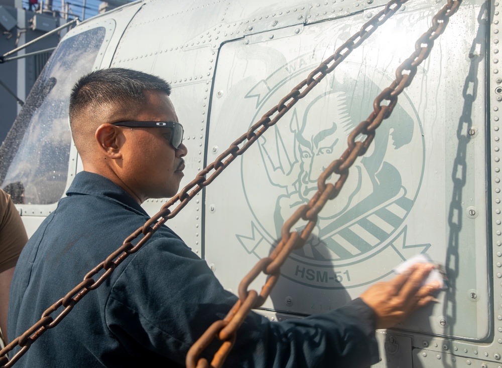 Sailors Aboard USS Ralph Johnson (DDG 114) Conduct a Helicopter Wash Down