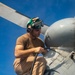 Sailors Aboard USS Ralph Johnson (DDG 114) Conduct a Helicopter Wash Down