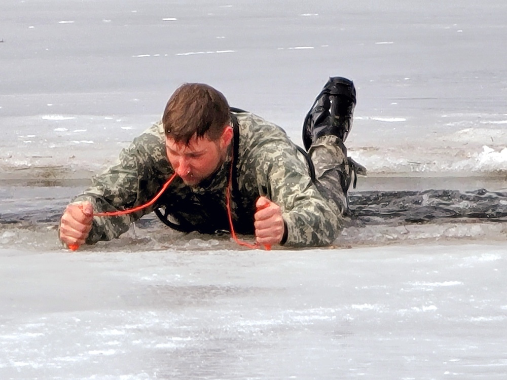 Cold-Weather Operations Course students jump in for cold-water immersion training at Fort McCoy