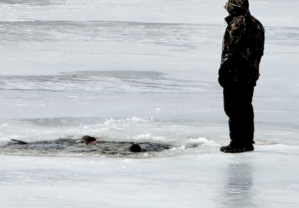 Cold-Weather Operations Course students jump in for cold-water immersion training at Fort McCoy