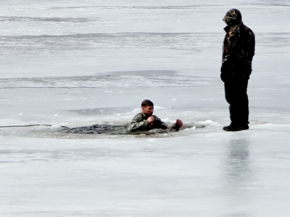 Cold-Weather Operations Course students jump in for cold-water immersion training at Fort McCoy