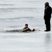 Cold-Weather Operations Course students jump in for cold-water immersion training at Fort McCoy