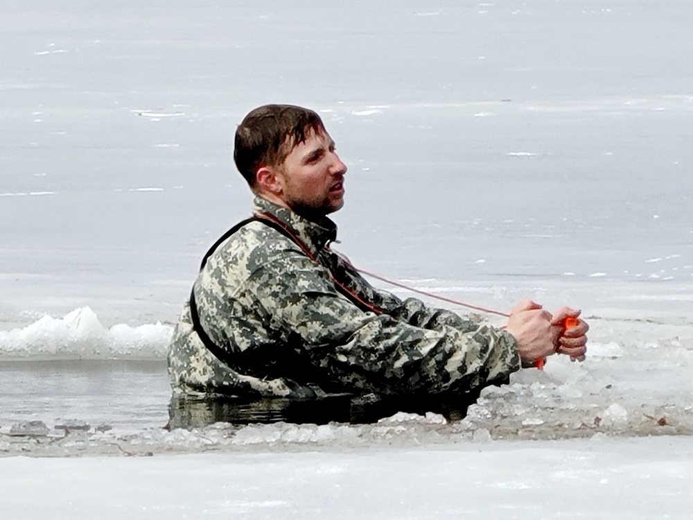 Cold-Weather Operations Course students jump in for cold-water immersion training at Fort McCoy