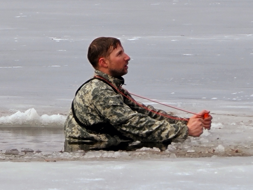 Cold-Weather Operations Course students jump in for cold-water immersion training at Fort McCoy