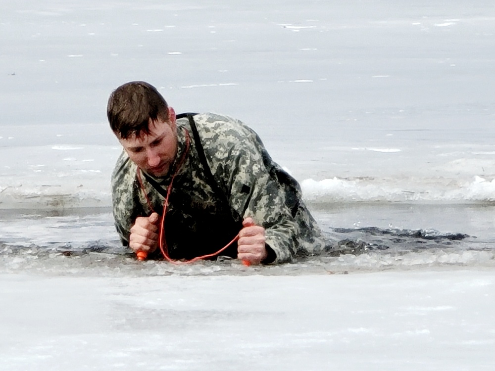 Cold-Weather Operations Course students jump in for cold-water immersion training at Fort McCoy